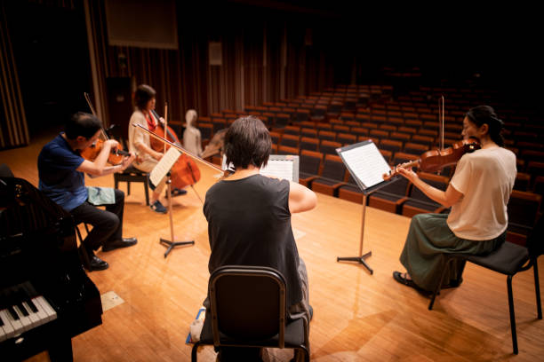 istock Musician playing violin, viola and cello at classical concert 1277159408