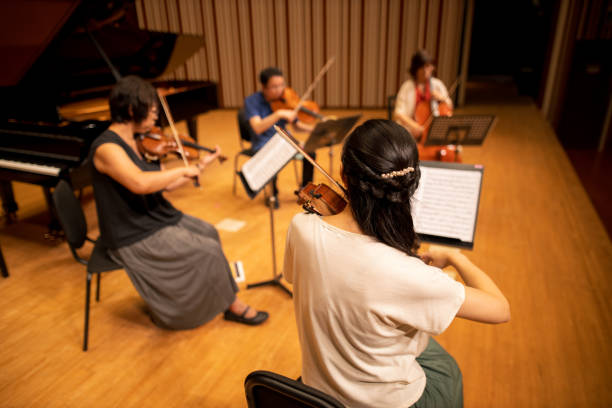 istock Musician playing violin, viola and cello at classical concert 1277159517
