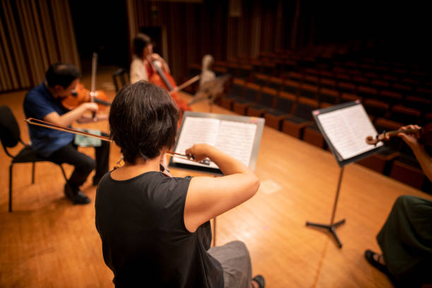 istock Musician playing violin, viola and cello at classical concert 1277159586