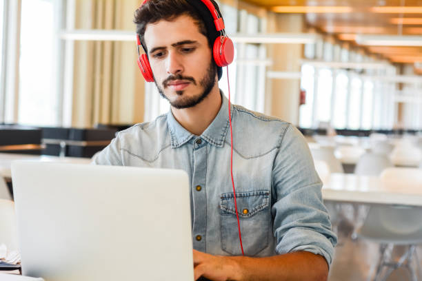 istock Young male student studying at university campus. 1277161106