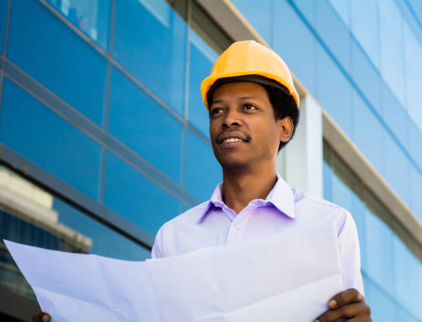 istock Professional architect holding blueprints outdoors. 1277161108