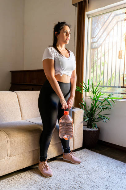 istock Young woman using non-traditional weight 1277162074