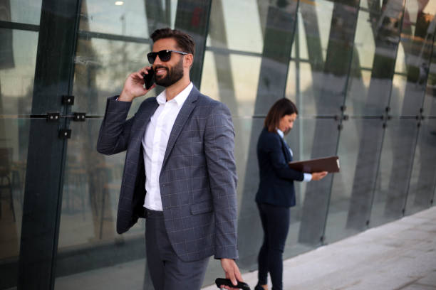 istock A handsome businessman talking on the phone 1277162329