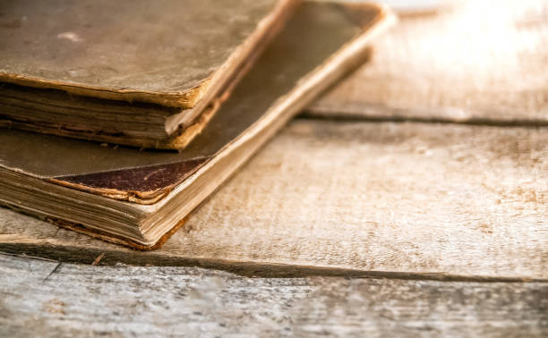 istock Old Books on Wooden Table 1277163713