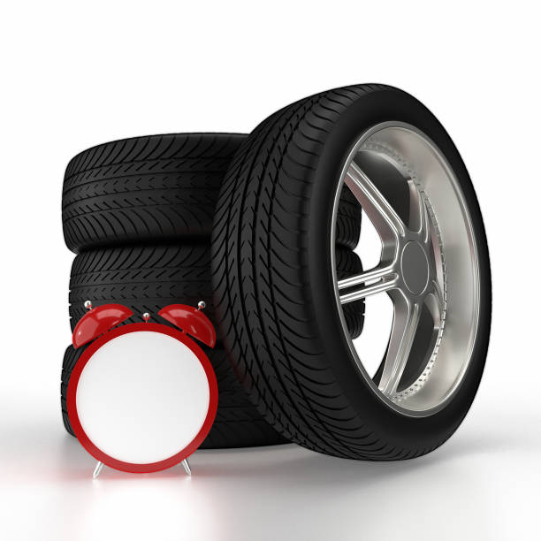 Car wheels and red alarm clock isolated on white background. 3D rendering
