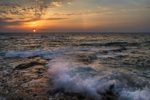 istock ocean surf on a beautiful rocky coast at sunrise 1277166645