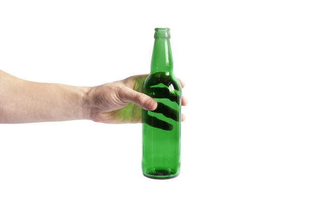istock Glass bottle in hand on a white background. Empty bottle. Green bottle on a clean background 1277168666