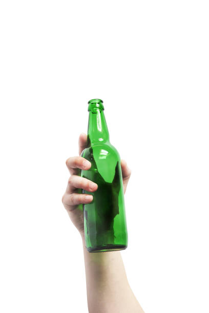 istock Glass bottle in hand on a white background. Empty bottle. Green bottle on a clean background 1277169055