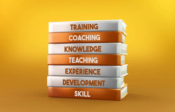 istock Orange and white Training books stand on an orange background 1277169155
