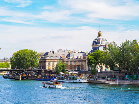 In July 2020, tourists were walking on Pont des Arts to the Institut de France (French Acamedy / Académie Française).