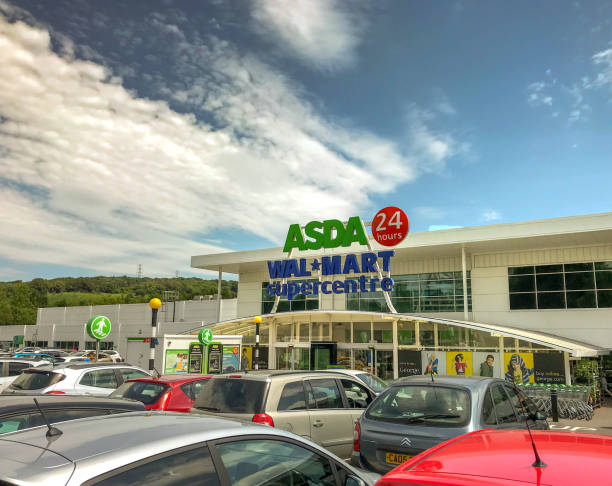 Front of an Asda superstore Cardiff, wales - July 2018: Exterior front view of an Asda superstore. The store is open 24 hours. Cars are parked in the foreground. asda photos stock pictures, royalty-free photos & images