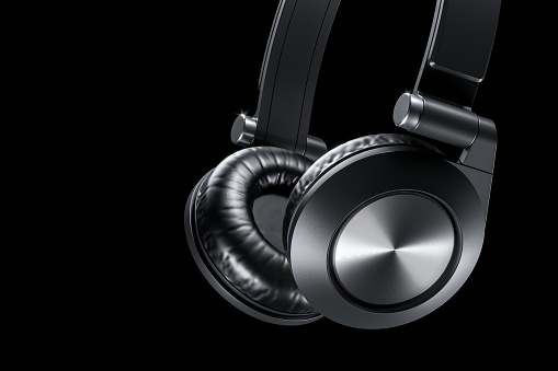 Black wireless headphones closeup on dark background 3D