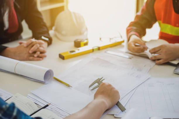 istock Businessman, construction project owner and engineer planning and meeting construction plan together. 1277171275
