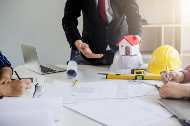 istock Businessman, construction project owner and engineer planning and meeting construction plan together. 1277171283