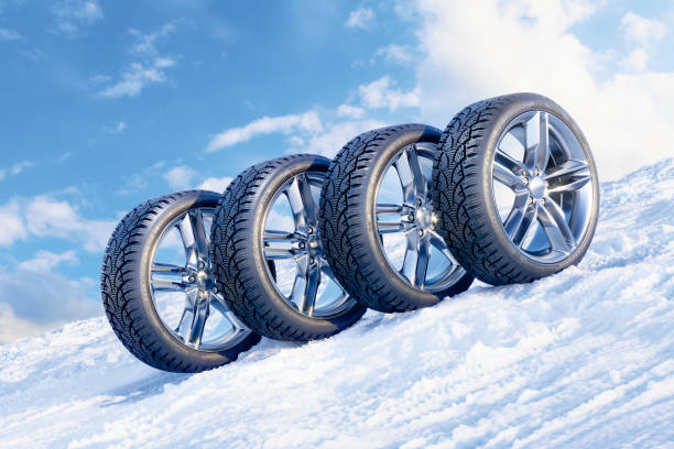 istock Car wheels in row on a snowy mountain slope 1277172216