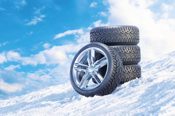 Car wheels on a snowy mountain slope