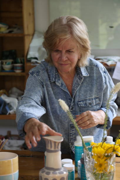 istock retired woman making pottery in her workshop 1277172393