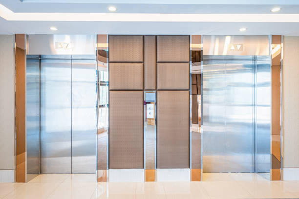 istock Modern steel elevator cabins in a lobby Hotel or office building. 1277172542