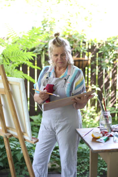 istock 70 years old women having pleasure doing art 1277172826