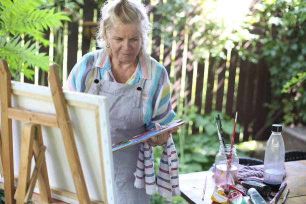 istock 70 years old women having pleasure doing art 1277172845