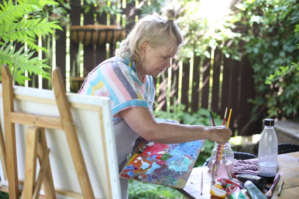 istock 70 years old women having pleasure doing art 1277172991