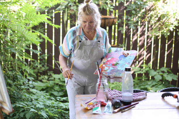 istock 70 years old women having pleasure doing art 1277173002
