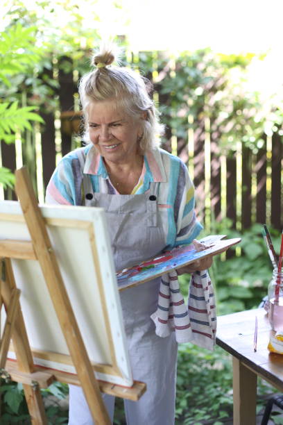 istock 70 years old women having pleasure doing art 1277173017