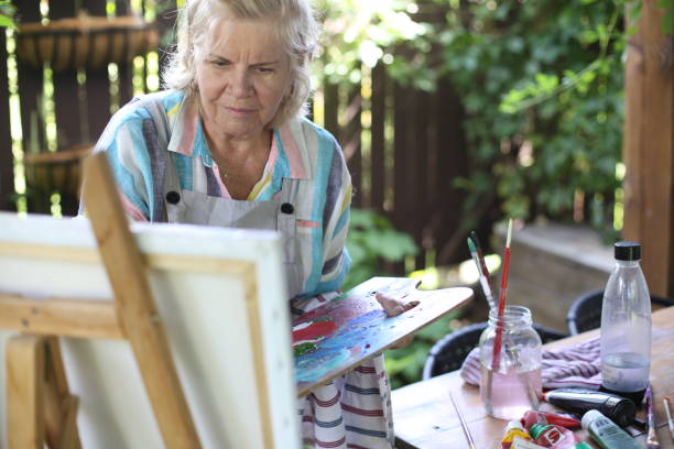 istock 70 years old women having pleasure doing art 1277173116