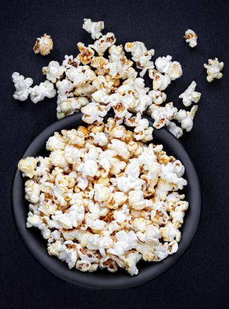 istock Homemade Kettle Corn Popcorn on black background with copy space. Top view