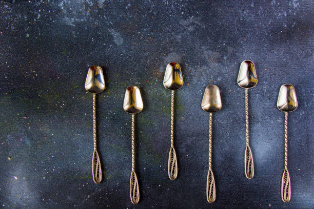 istock Silverware, silver vintage spoon background, spoon set on the dark background 1277175806