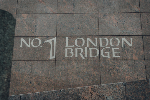 London, UK - August 24, 2020: Name sign on One London Bridge, newly refurbished luxury office space with panoramic views of some of the most iconic buildings in the city.