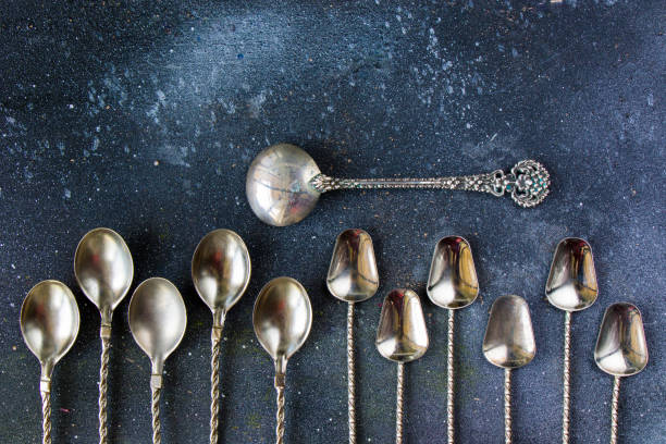istock Silverware, silver vintage spoon background, spoon set on the dark background 1277176595