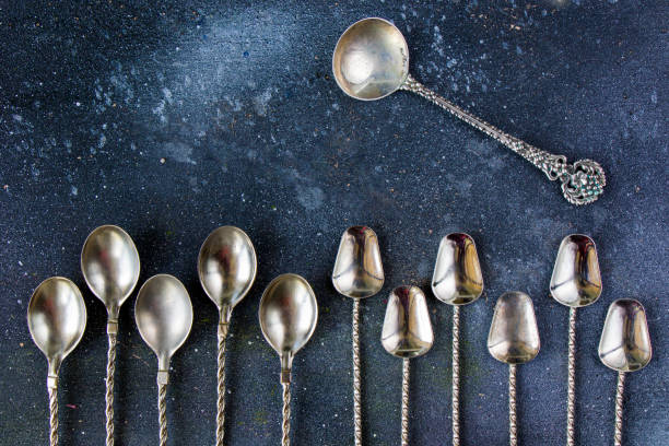istock Silverware, silver vintage spoon background, spoon set on the dark background 1277176600