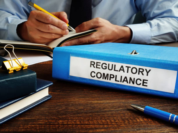 istock Regulatory compliance papers in the folder and manager. 1277178967