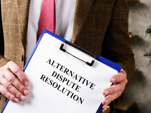 istock Lawyer offers documents alternative dispute resolution ADR and pen. 1277178977