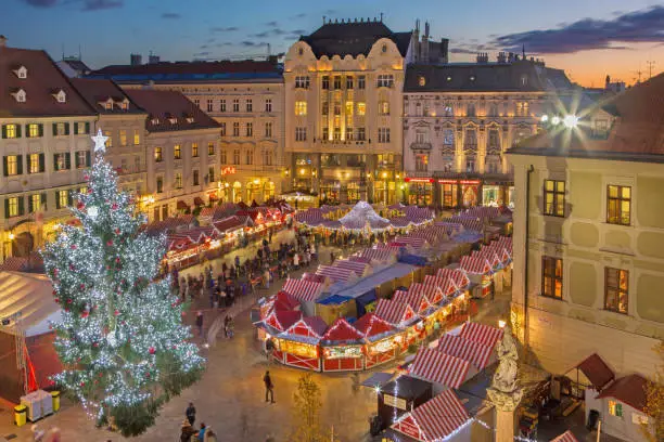 Photo of Bratislava - Christmas market on the Main square in evening dusk.