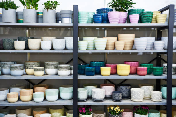 Colorful flower pots on the shelf in the store