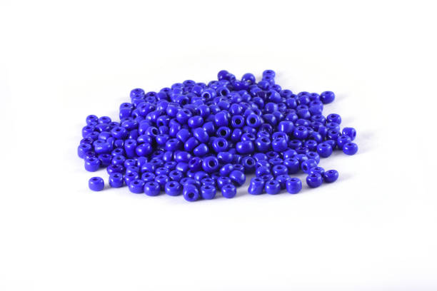 istock Beads spread on white background. Background or texture of beads. Close up, macro,It is used in finishing fashion clothes. make bead necklace or beads for woman of fashion,Bead Crochet. Daily Beading. 1277181232