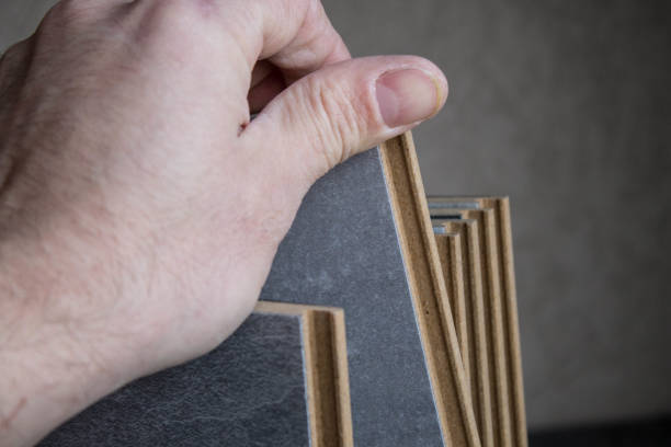 istock Laminate. Samples of laminate and floorboard. Cutting and laying flooring. 1277182129