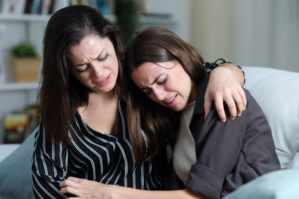 istock Two sad friends or sisters crying together at home 1277185446