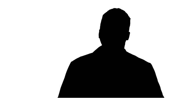 istock Silhouette Male African Doctor Standing With Hands In His Pocket 1277186380
