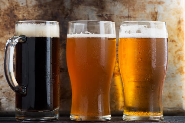 istock Three different Beers in glasses, dark ale, wheat beer and lager light beer 1277186517