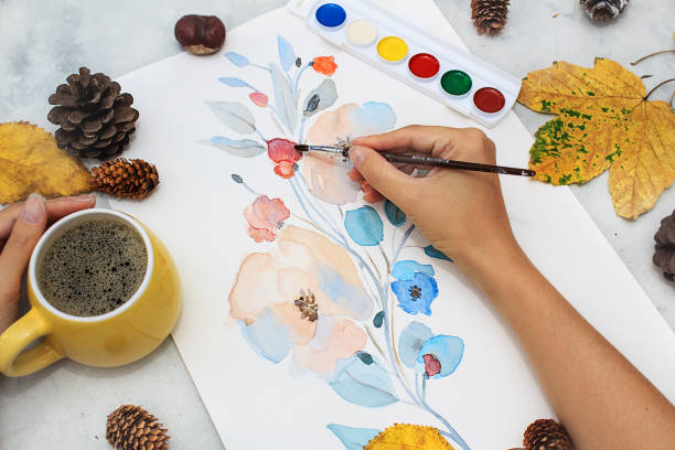istock Femal hand paint flowers 1277187698