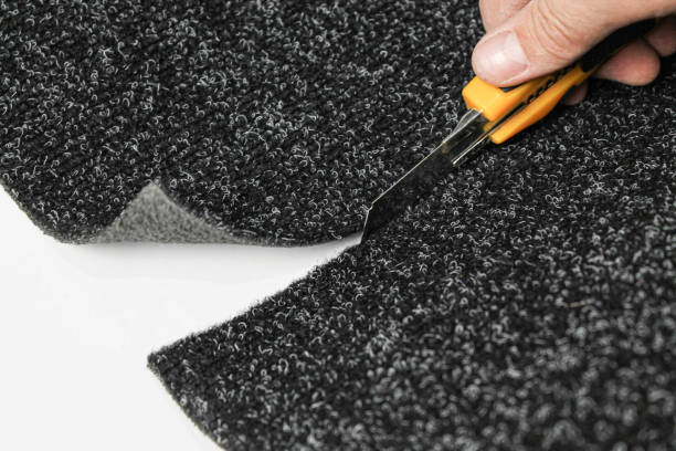 istock Carpet with rubber base on a white background. Cut a piece of carpet from a roll. 1277187710