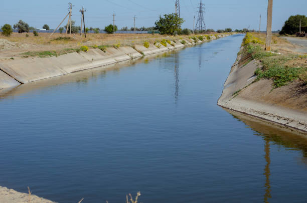 istock Irrigation agricultural channel with water. 1277187718