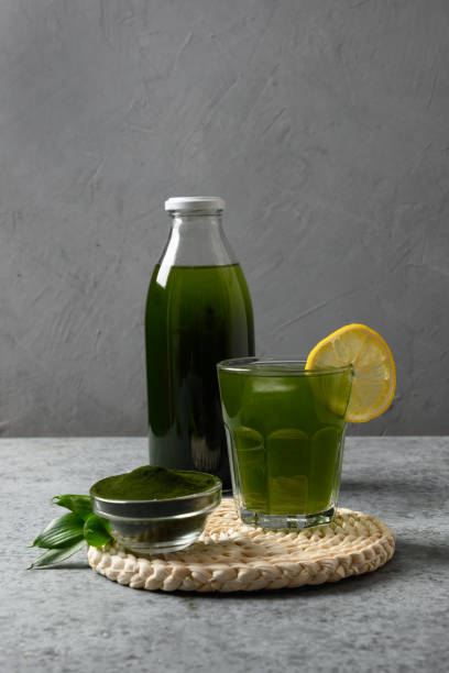 istock Chlorella healthy beverage in glass on a grey background. 1277187775