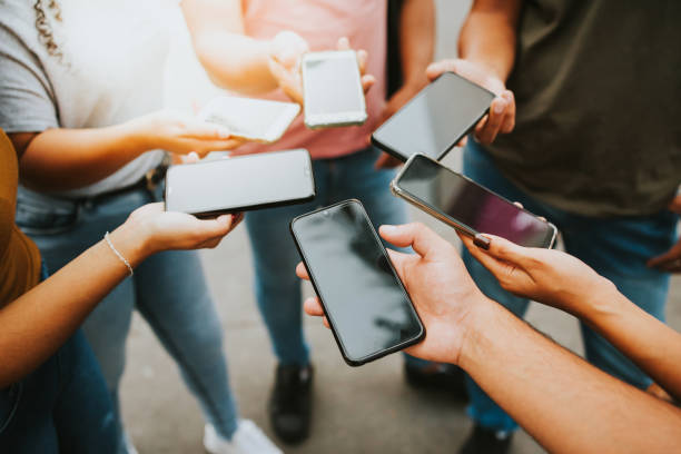 istock Group of people holding smartphone, device screen 1277187818