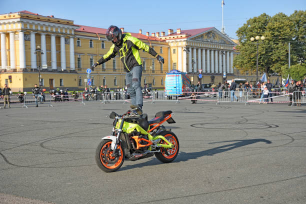 Verkhovazhye, Vologda Region, Russia - August 9, 2014: Smoke from a motorcycle wheel on stantraydinge in Verkhovazhye, Vologda region, Russia. Alexei Kalinin professional stantrayder. Champion of the Baltic States in 2005 Bronze medalist of the Baltic States in 2006 Member of the European Championship stantraydingu 2006 - 2007 Bronze medalist MOTUL M1 - Stunt Battle 2008 Champion MOTUL M1 - Stunt Battle 2009 (team classification. Team \