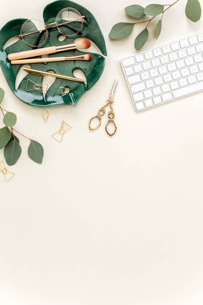 istock Flat lay home office desk. Female workspace with computer, plate sheet monstera, golden accessories, eucalyptus leaves, on beige background. Top view 1277194995