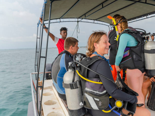 istock The big group of divers makes the final preparations aboard a boat, talking, and waiting for diving. 1277195258